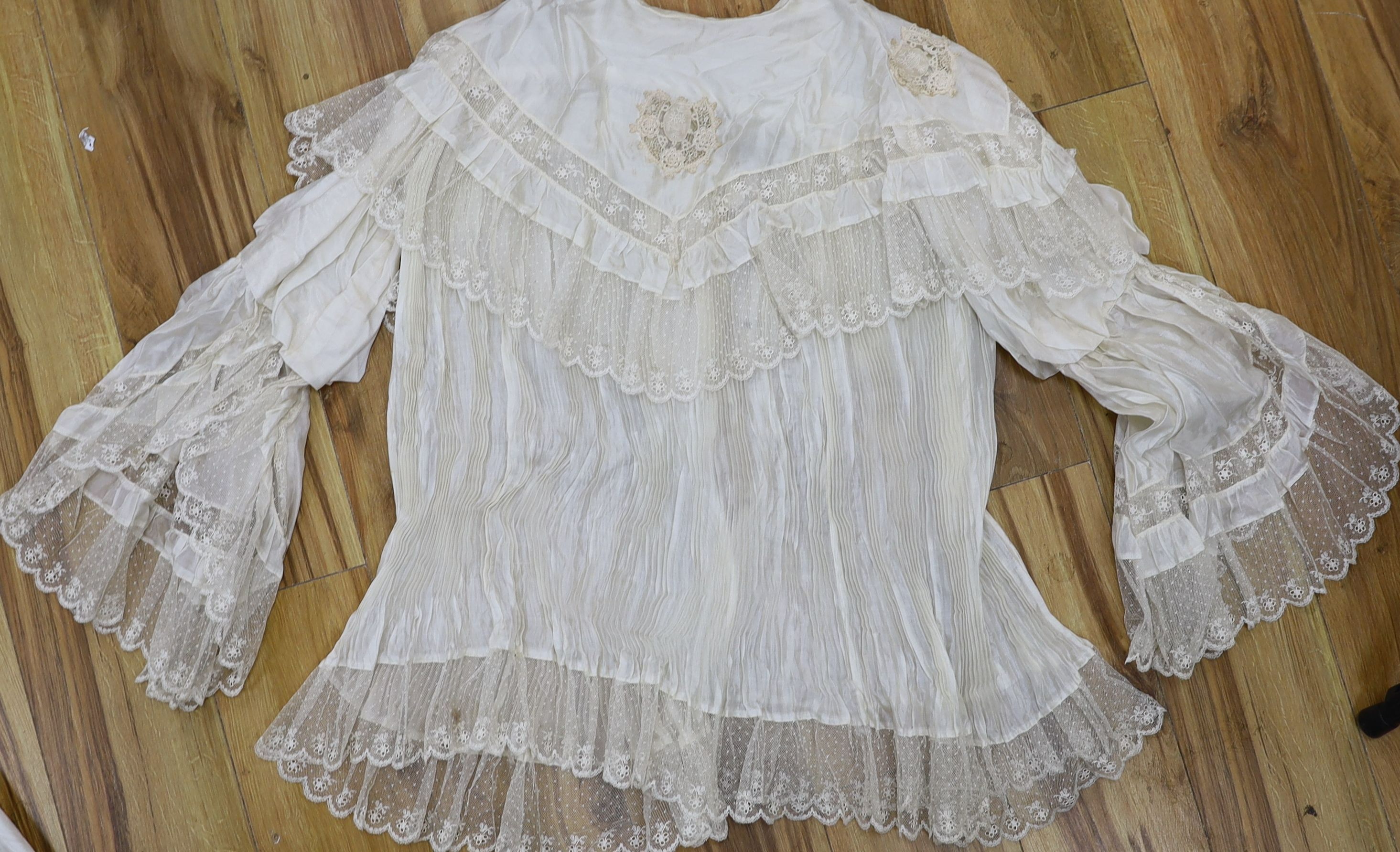 A fine cream silk and lace inserted pleated jacket